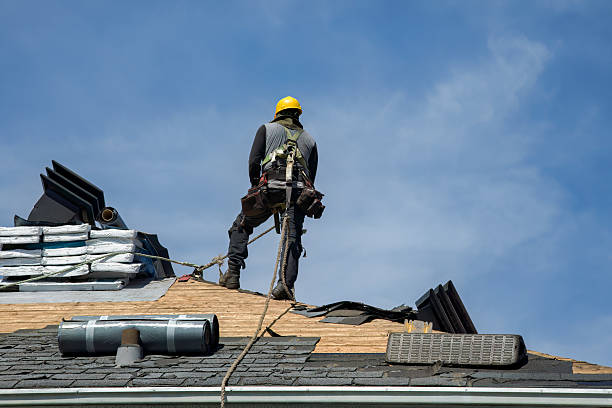 Professional Gutter Installation technician working in Smithville, MS